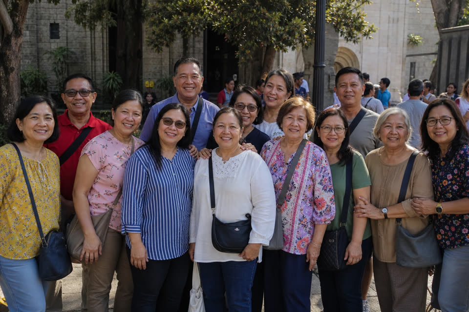 Manila Magdalene Fellowship smiling together in a stone courtyard